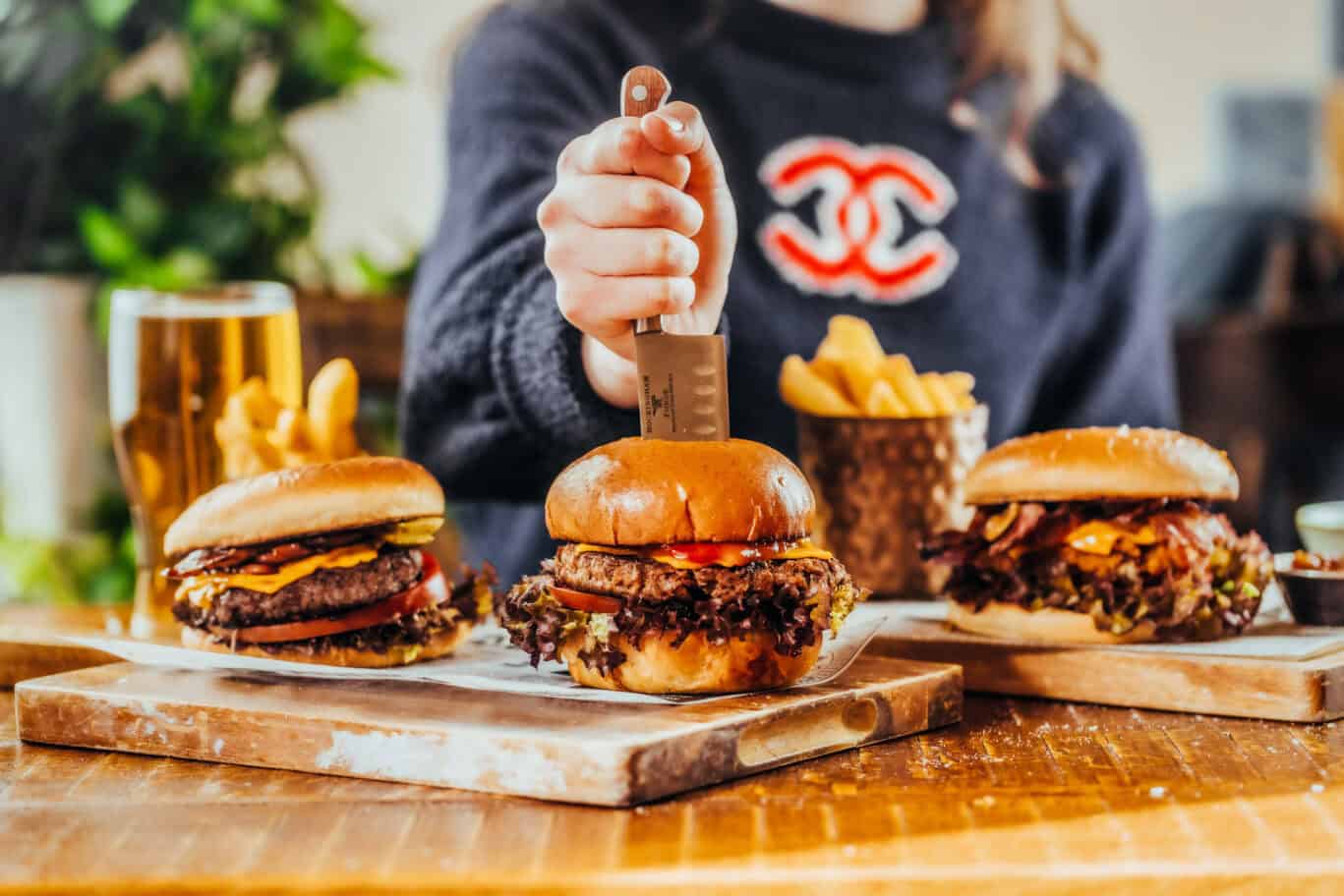 Tasty burgers with fries served at Liverpool Street Hostel, London.