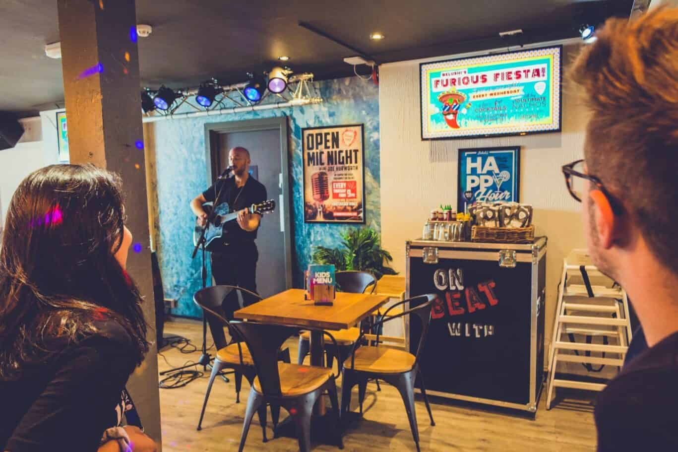 Live music performance at St Christopher’s Newquay hostel bar.