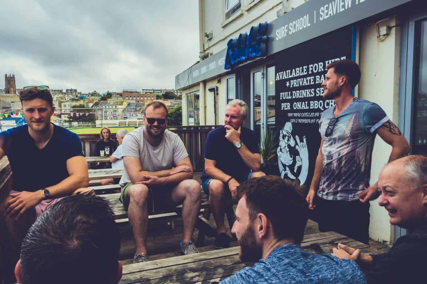 Enjoy a lively group of friends at St Christopher’s Newquay hostel, a popular seaside accommodation.