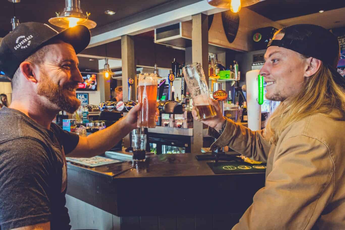 Two friends enjoying drinks at St Christopher’s Newquay bar.