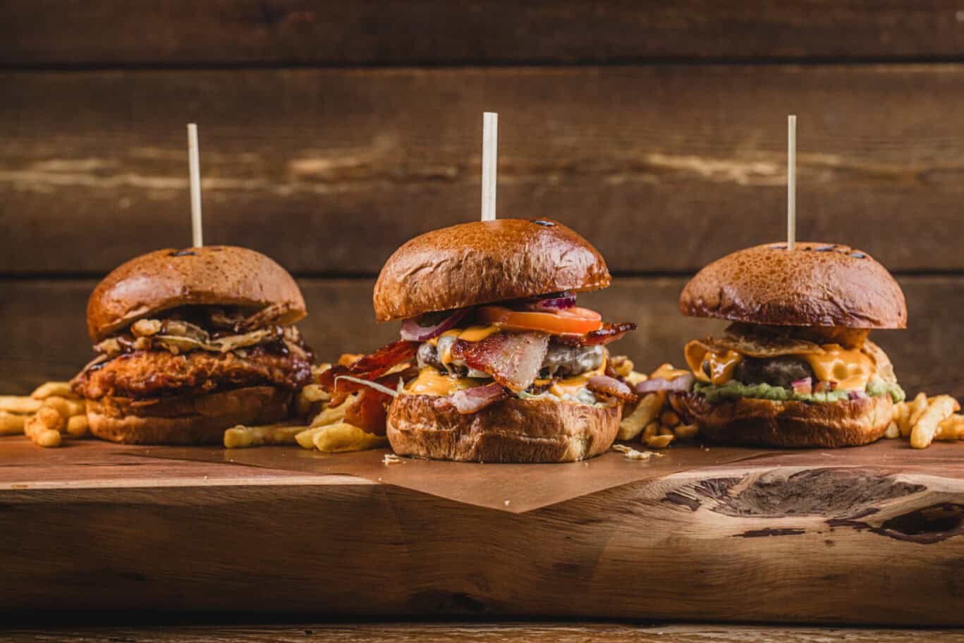 Gourmet burgers with crispy fries served at St Christopher’s Newquay hostel, perfect for travellers.