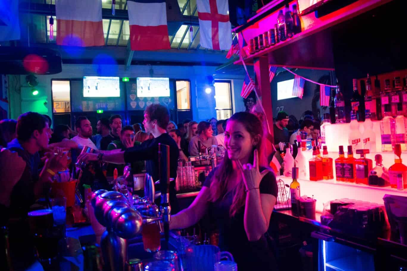 Bar at St Christopher’s Paris Hostel with lively atmosphere.