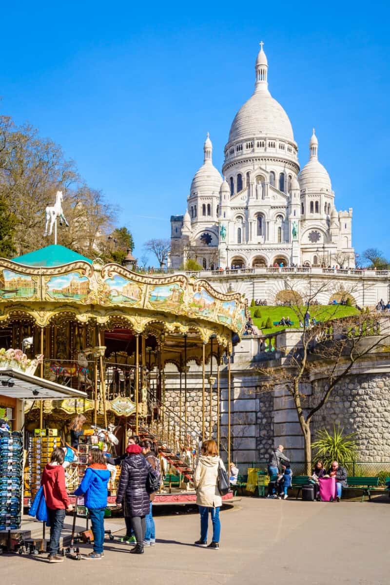Carousel of the Louise Michel park below the basilica of the Sacred Heart of Paris.