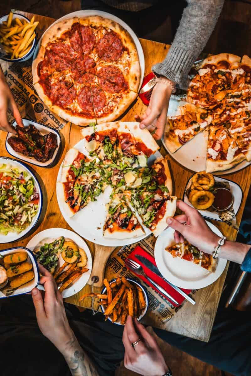 Delicious pizza and sharing plates at Shepherd's Bush Hostel restaurant.