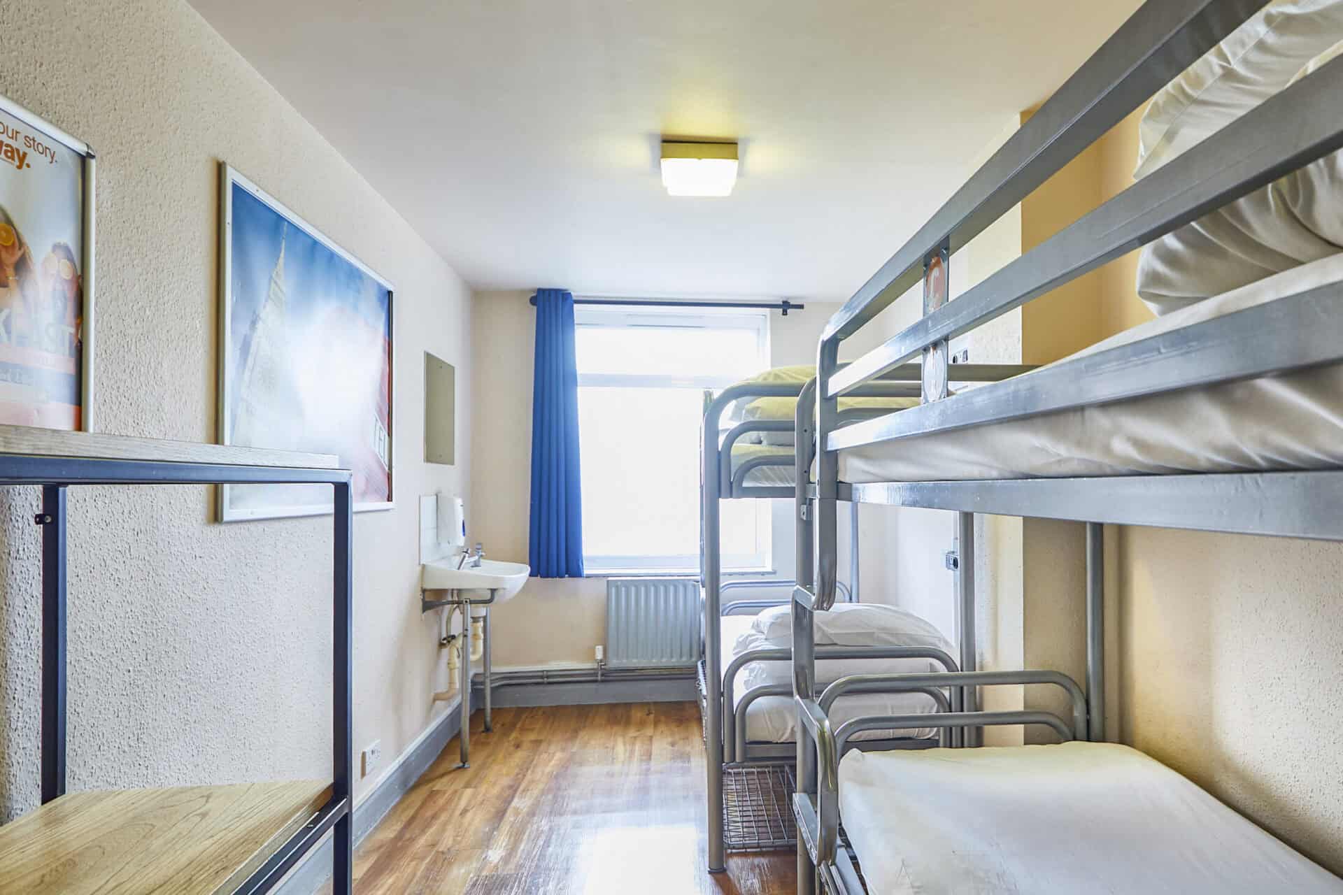 Shared dorm room at St Christopher's Shepherd's Bush hostel with bunk beds and window.