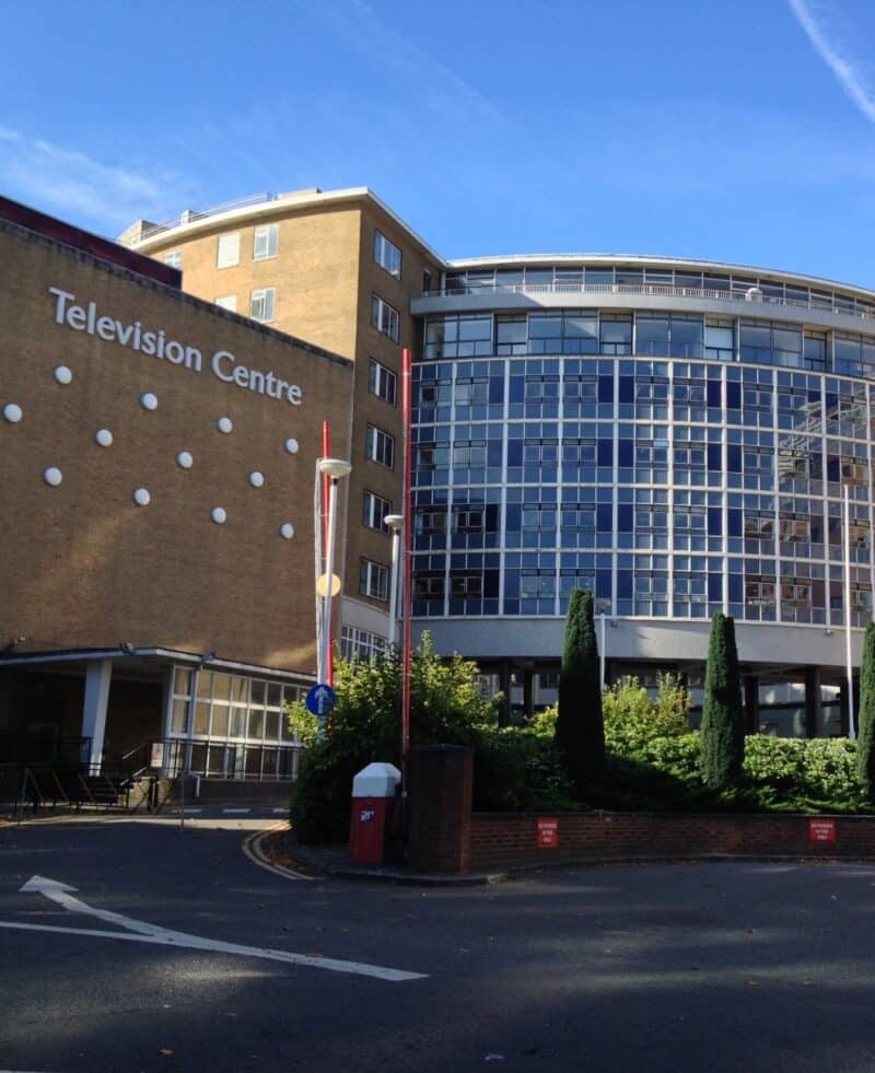Television Centre building in Shepherd's Bush, London, with modern glass facade.