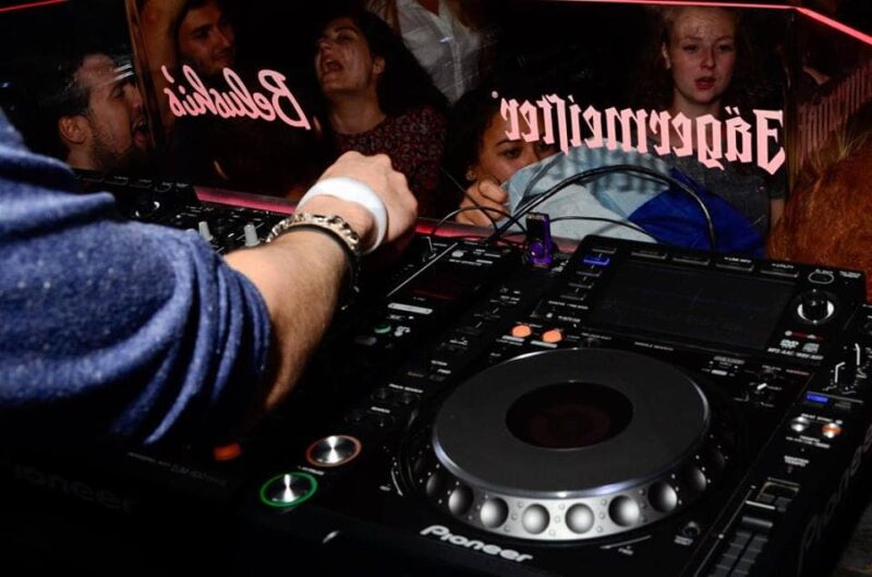 DJ playing music at St Christopher’s Vienna hostel nightclub.