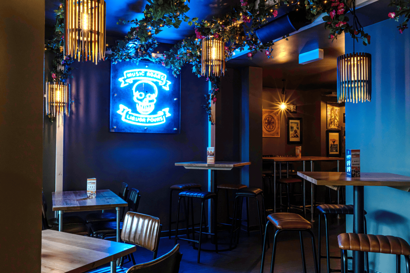 Music bar at St Christopher’s Vienna Hostel with colourful lighting and lively atmosphere.