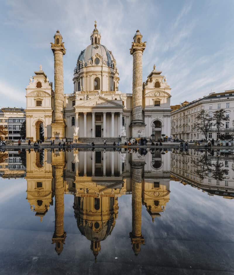 Sunset Light on St. Charles’ Church Karlskirche with Reflection in Vienna, Austria