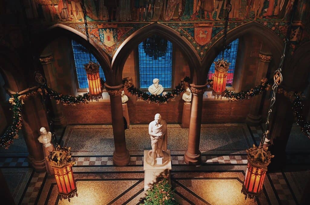 Historic church interior with statues and stained glass windows in Berlin Mitte.