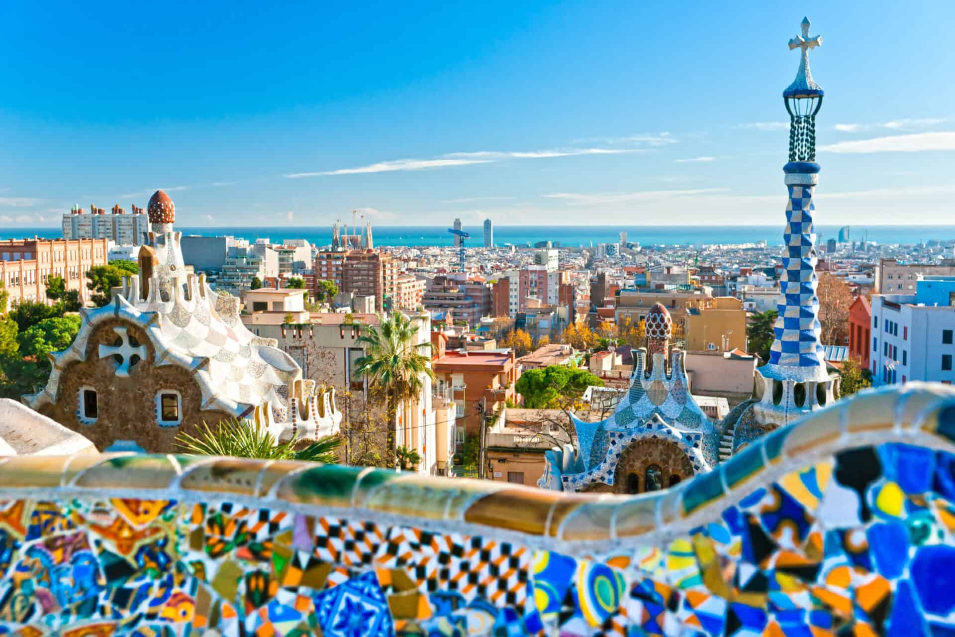 Panoramic view of Berlin from Park Güell, featuring colourful mosaics and architectural details.