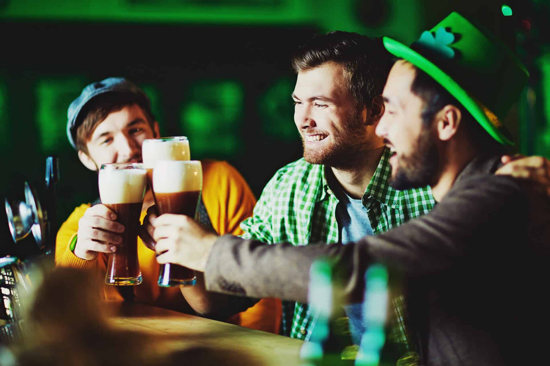 Friends enjoying drinks at a lively bar in Berlin Mitte.