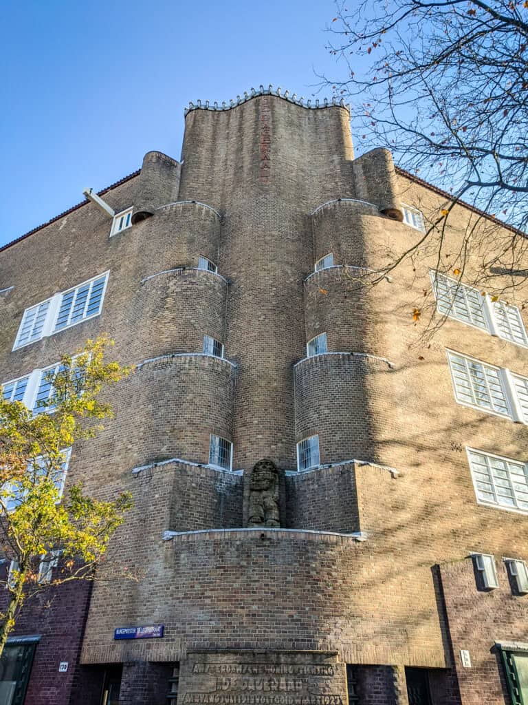 Historic Berlin building with unique brick architecture and small balconies.
