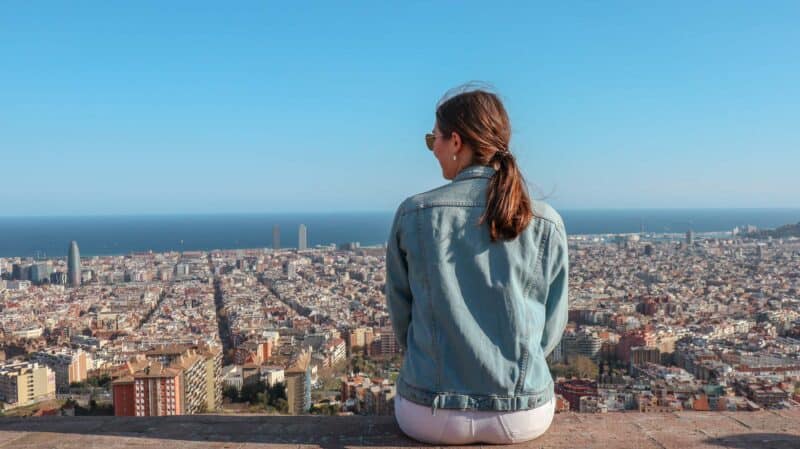 Young woman overlooking Berlin skyline from Mitte Hostel.