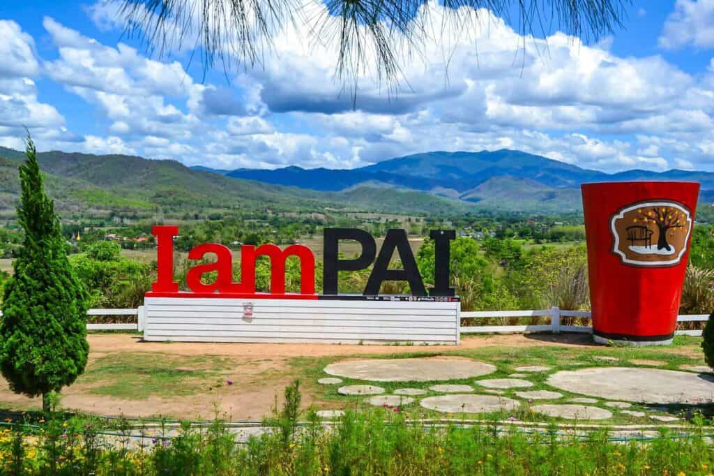 Beautiful landscape view with "I am PAL" sign and large coffee cup sculpture in Mitte, Berlin.