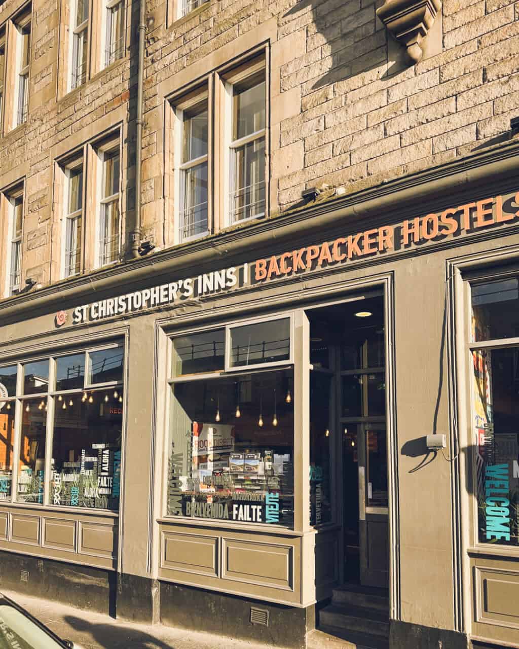 Exterior view of St Christopher's Backpacker Hostel in a historic building, welcoming travellers.