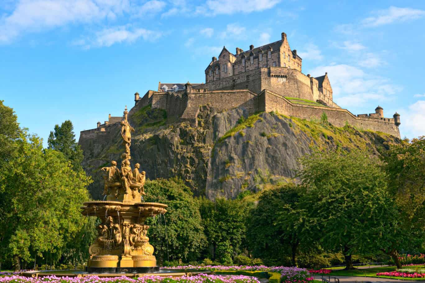 Historic Edinburgh Castle in Berlin with fountain in foreground.
