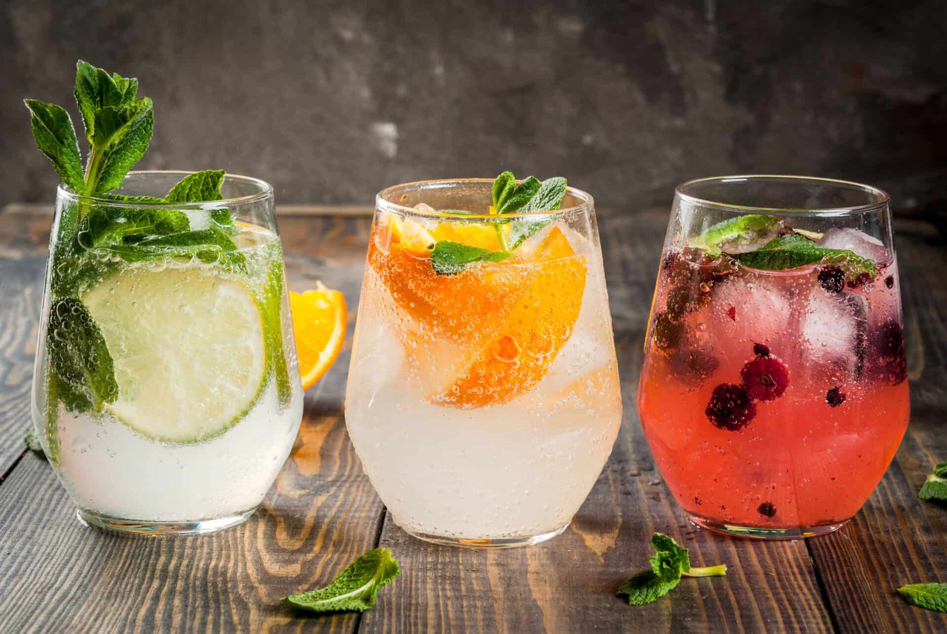 Colourful fruit cocktails with fresh mint and citrus slices at St Christopher’s Berlin - Mitte hoste.