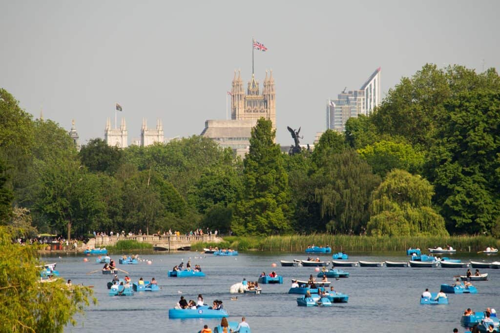 View of Mitte Hostel and Berlin skyline with river and boats in the foreground.