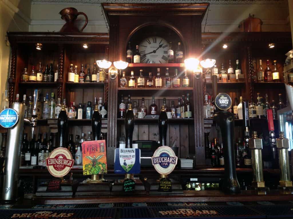 Historic pub bar with beer taps and vintage decor in Berlin Mitte.