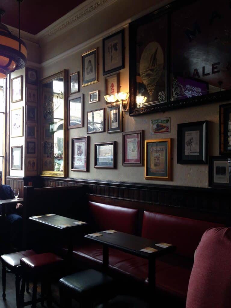 Interior view of Mitte Hostel at St Christopher’s Berlin, showcasing cozy seating and wall art.