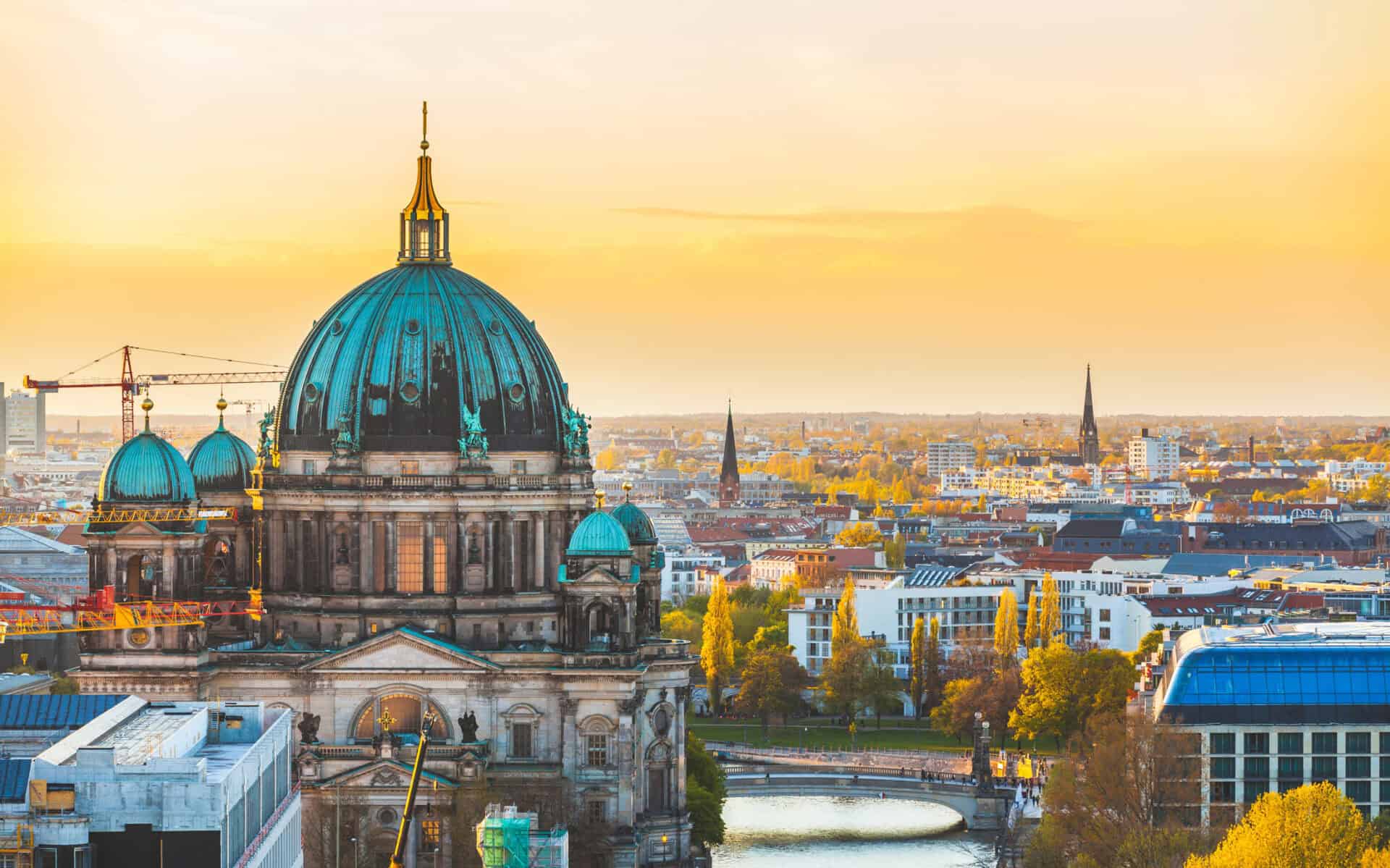 Iconic Berlin skyline with historic cathedral at sunset, showcasing Mitte district.