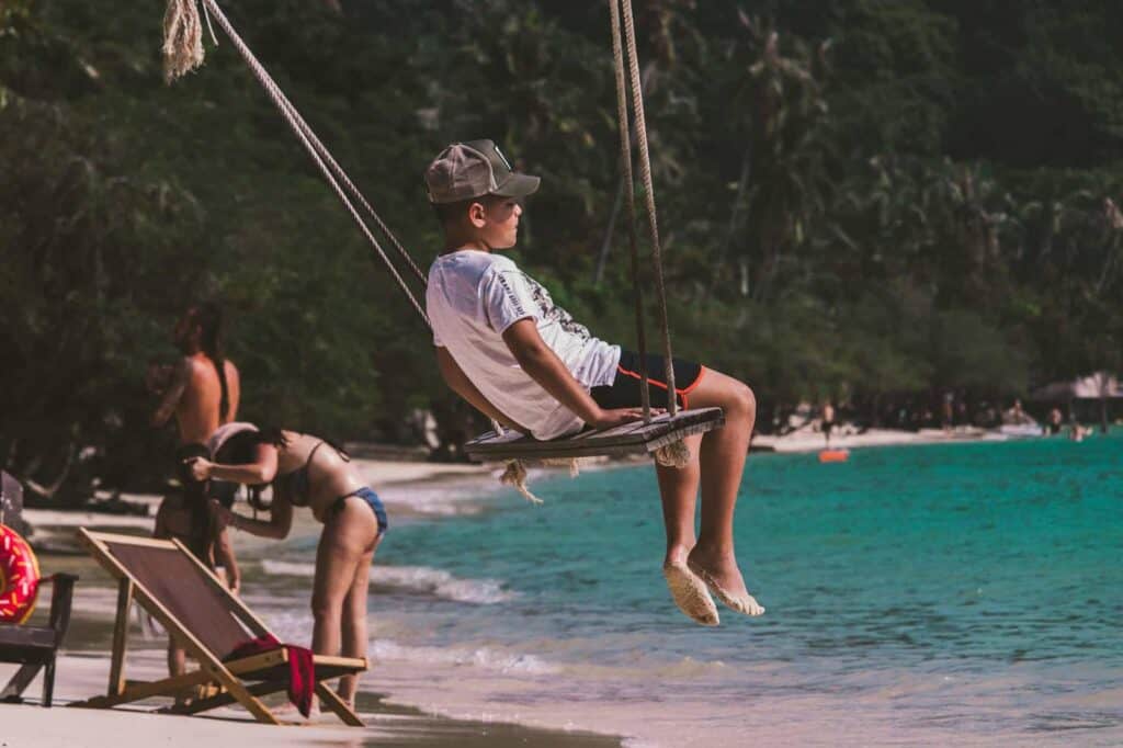 Child swinging over the beach at St Christopher’s Berlin - Mitte hostel.