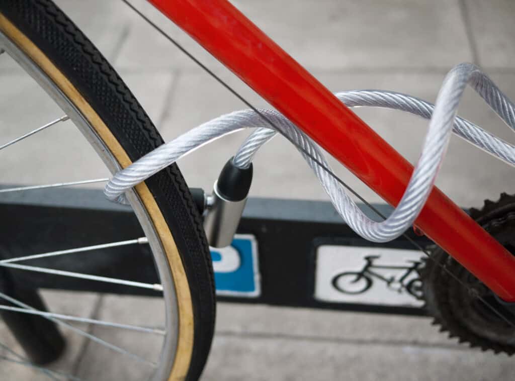 Bicycle locked with a cable lock at St Christopher’s Berlin - Mitte. Safe bike storage in the vibran.