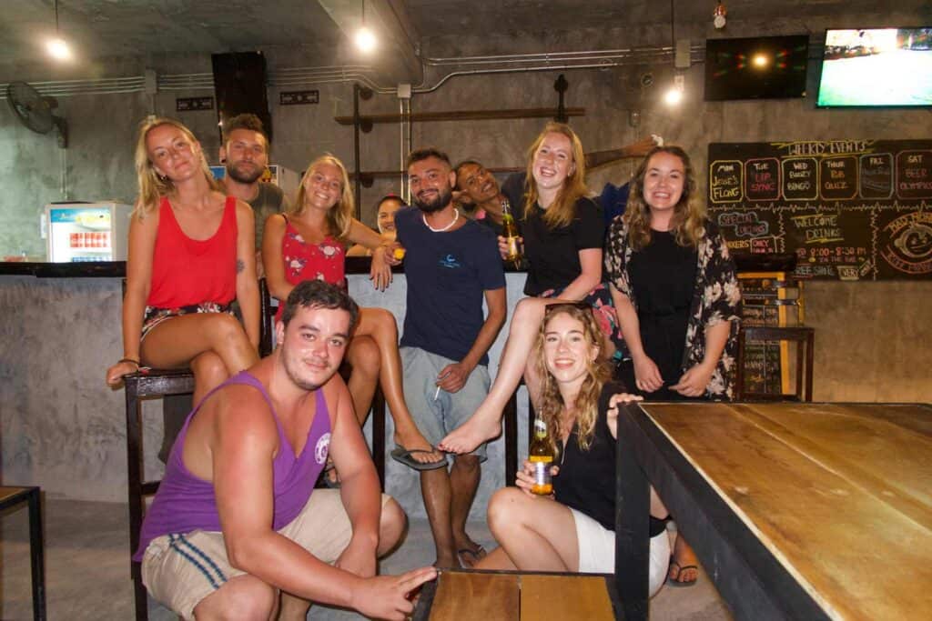Group of young people enjoying drinks at Mitte Hostel bar in Berlin.
