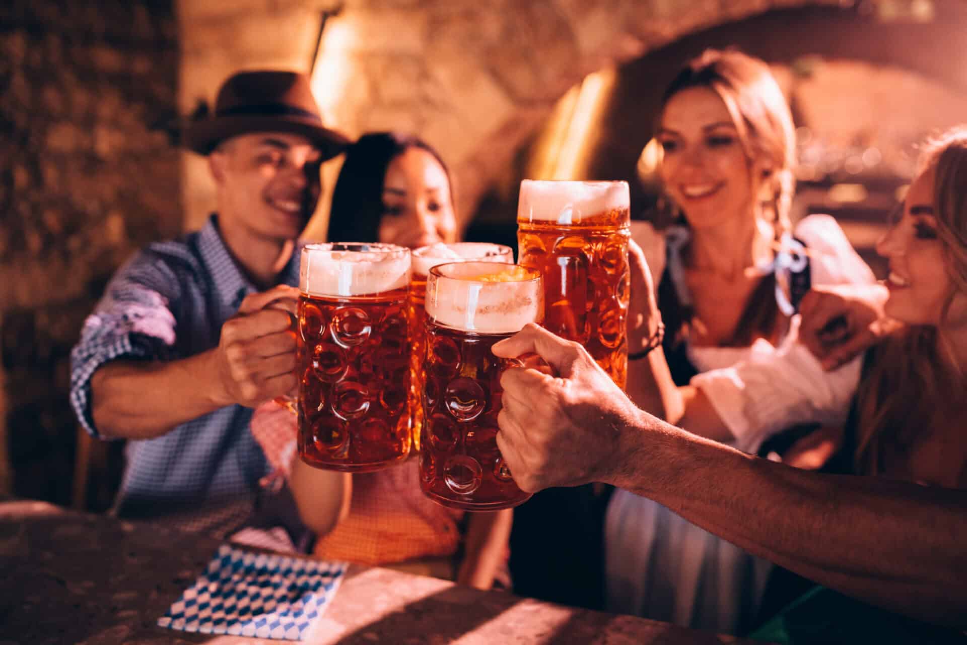 Group of friends enjoying beers at a bar in Berlin Mitte, Germany.