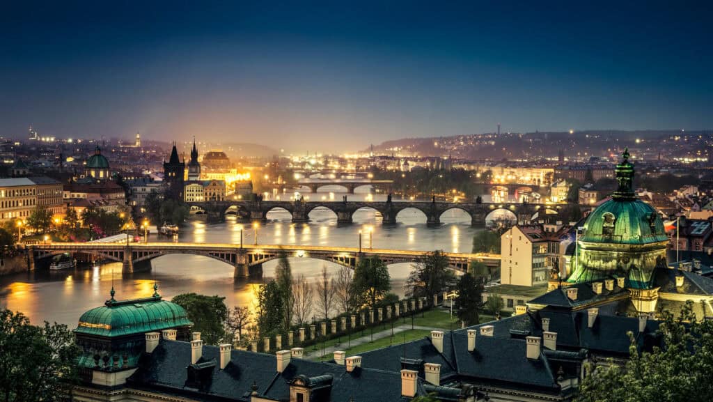 Night view of Mitte district with historic bridges and illuminated buildings in Berlin, Germany.