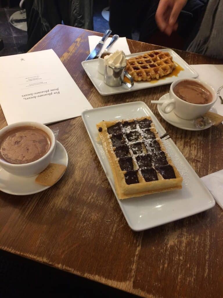Delicious waffles and hot chocolate served at a charming café in Berlin Mitte. Perfect for a relaxin.
