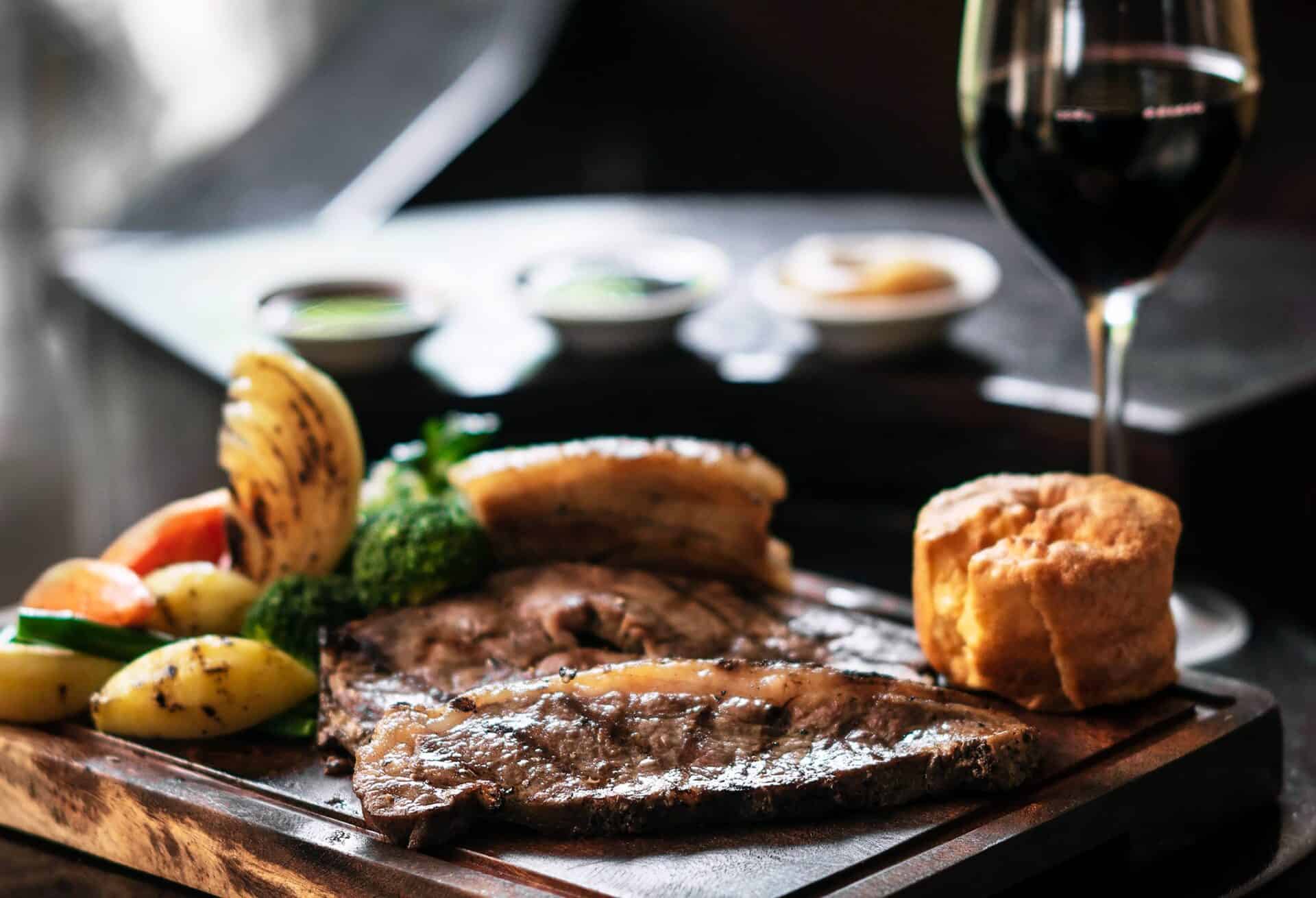 Delicious grilled steak served with vegetables and bread at St Christopher’s Berlin - Mitte hostel.
