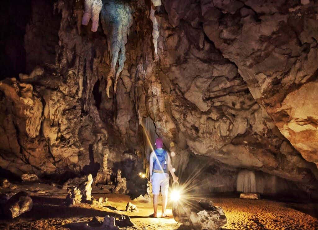 Adventurous person exploring a cave in Berlin's Mitte district.