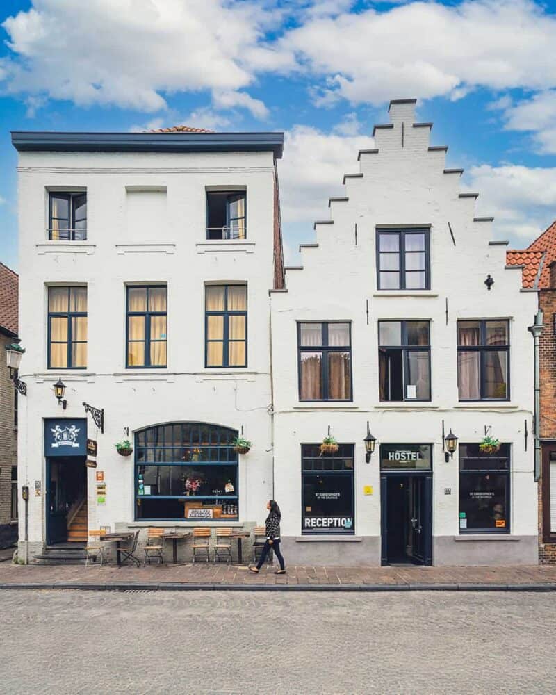 A traditional European guesthouse with a stepped gable facade and a hostel entrance.