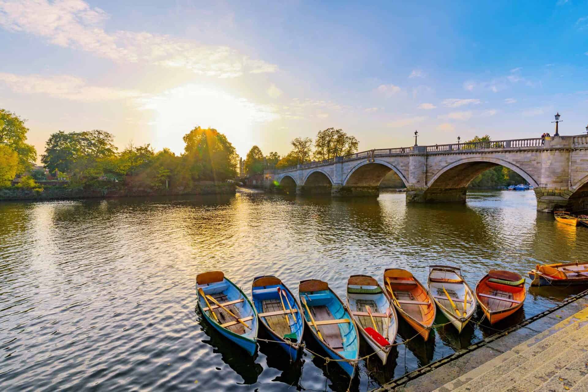 Beautiful view of boats on the river in Berlin’s Mitte district with a historic bridge in the backgr.