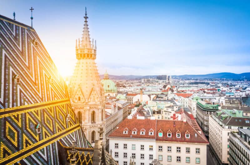 View of Berlin cityscape with historic architecture and rooftops at sunset.