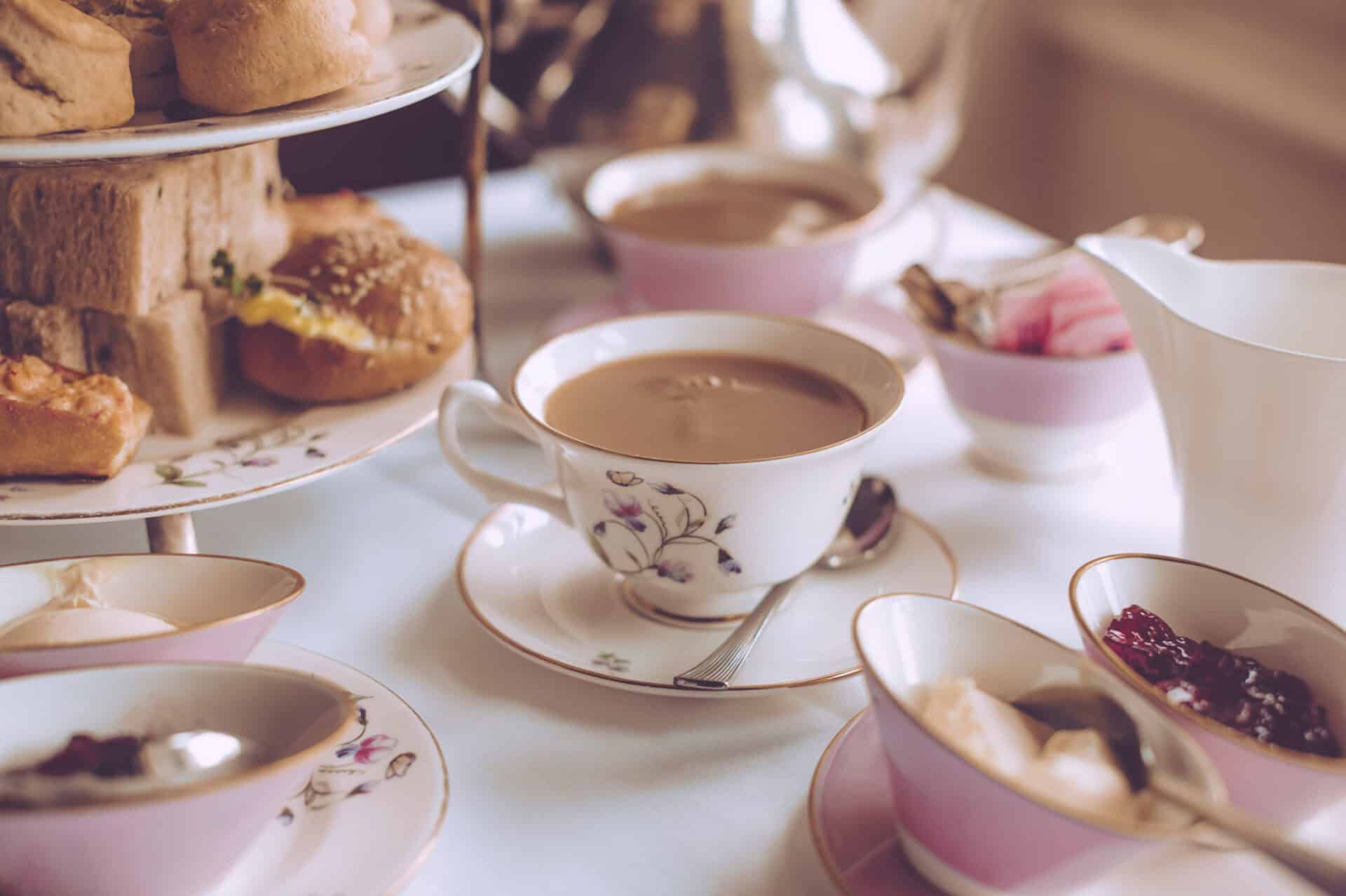 Elegant afternoon tea setup with tea, scones, and jams at St Christopher’s Berlin - Mitte.