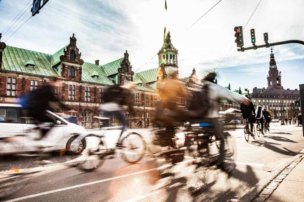 Urban street scene with cyclists and cars in Berlin Mitte.