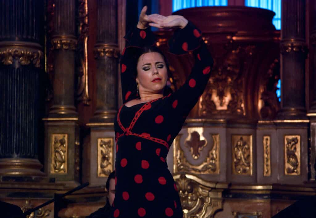 Elegant flamenco dancer performing in historic venue, showcasing cultural events at St Christopher’s.