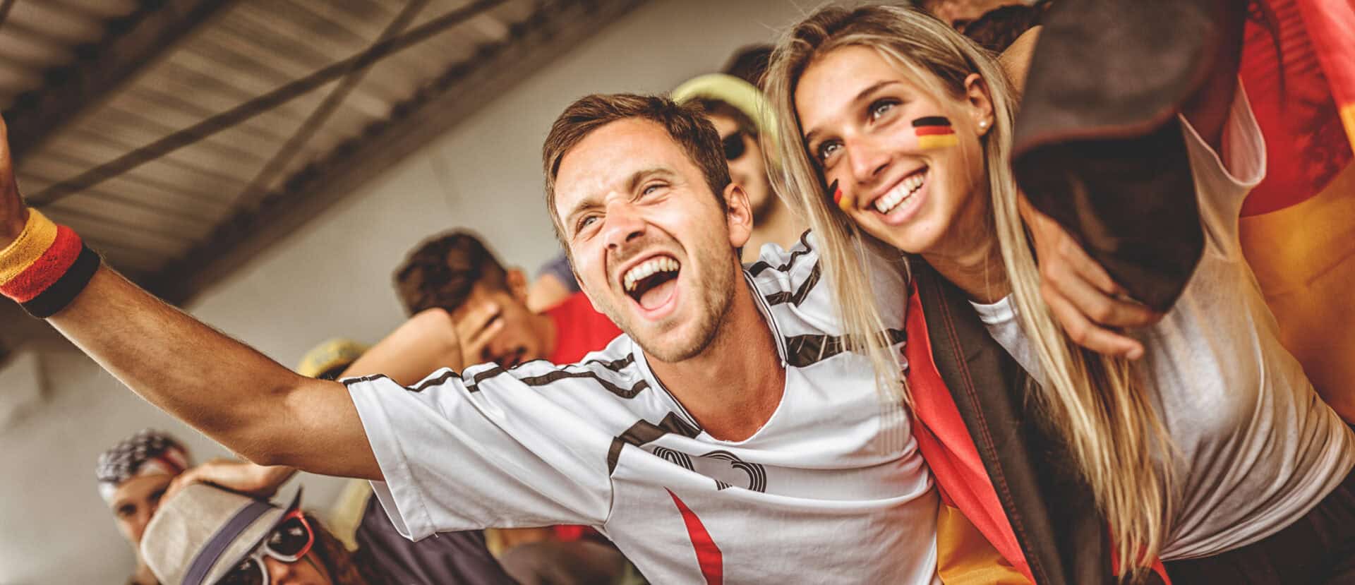 Vibrant group of young people enjoying a lively atmosphere at Mitte Hostel, Berlin.