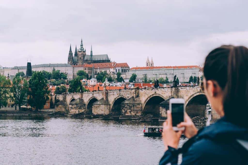 girl-taking-photo-over-canal