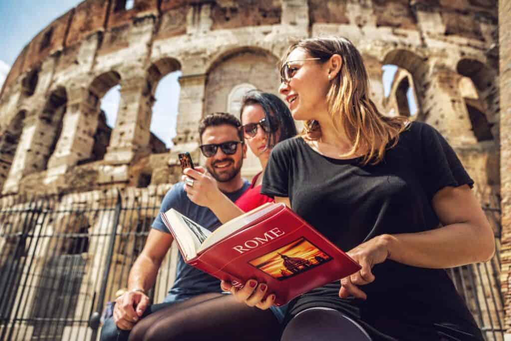 Group of young tourists exploring the Roman Amphitheatre in Berlin's Mitte district.