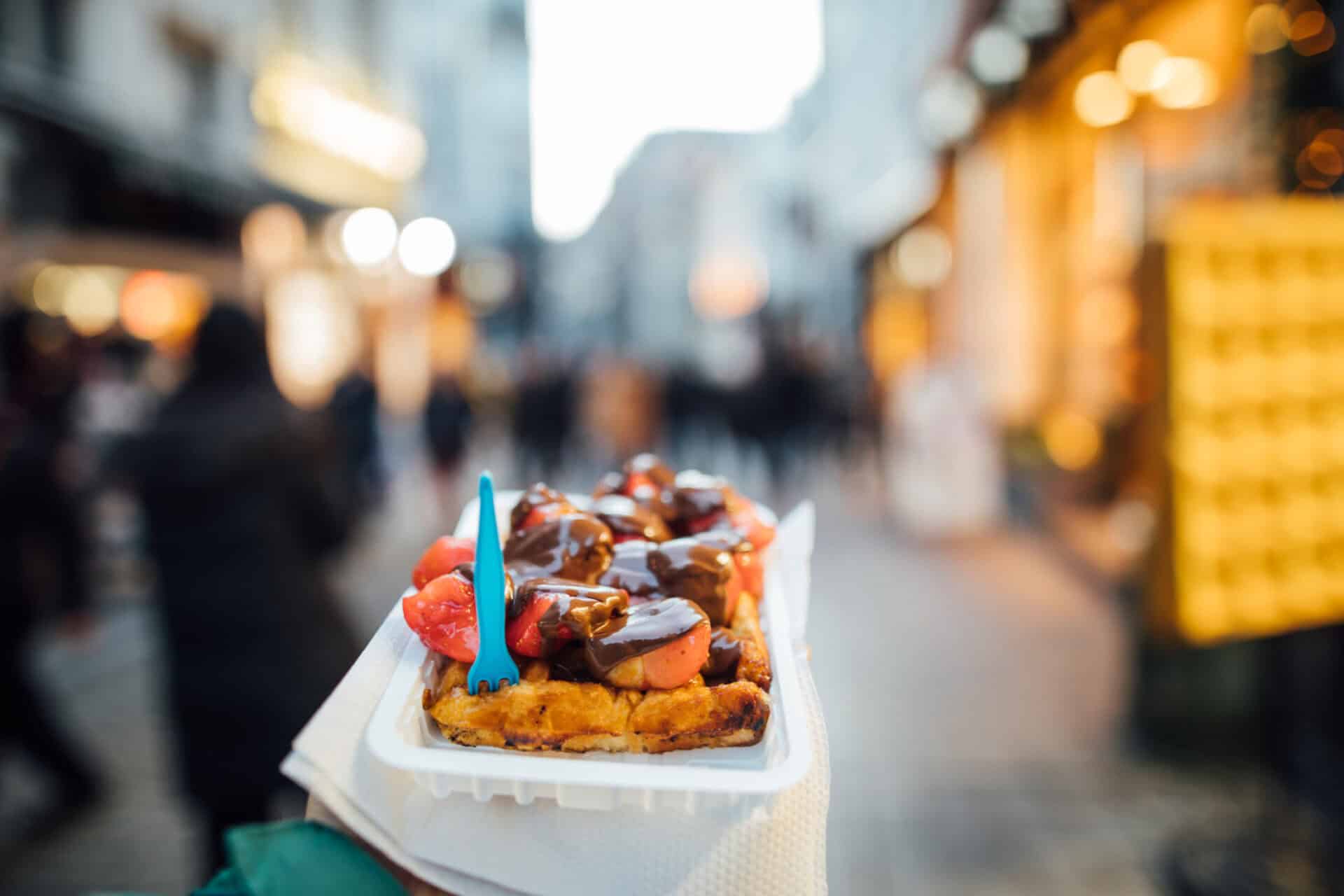 Vibrant street food scene in Berlin with a focus on local snacks and lively atmosphere.