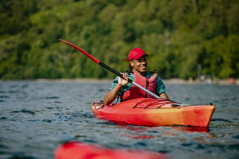Kayaking on the river near St Christopher’s Berlin - Mitte hostel, showcasing outdoor activities in.