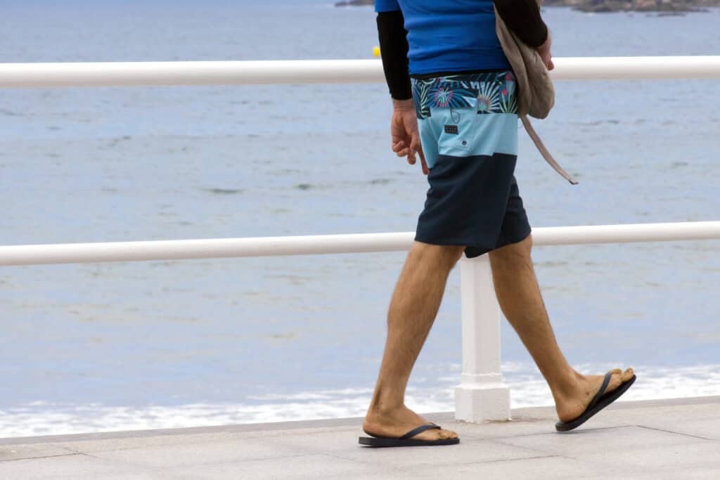 Person walking along the waterfront at Mitte Hostel, Berlin.