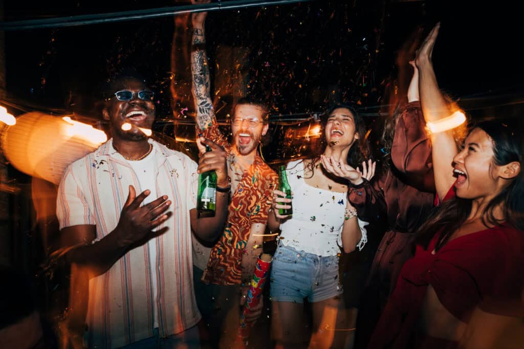 Group of young people celebrating at a lively party in Berlin Mitte.