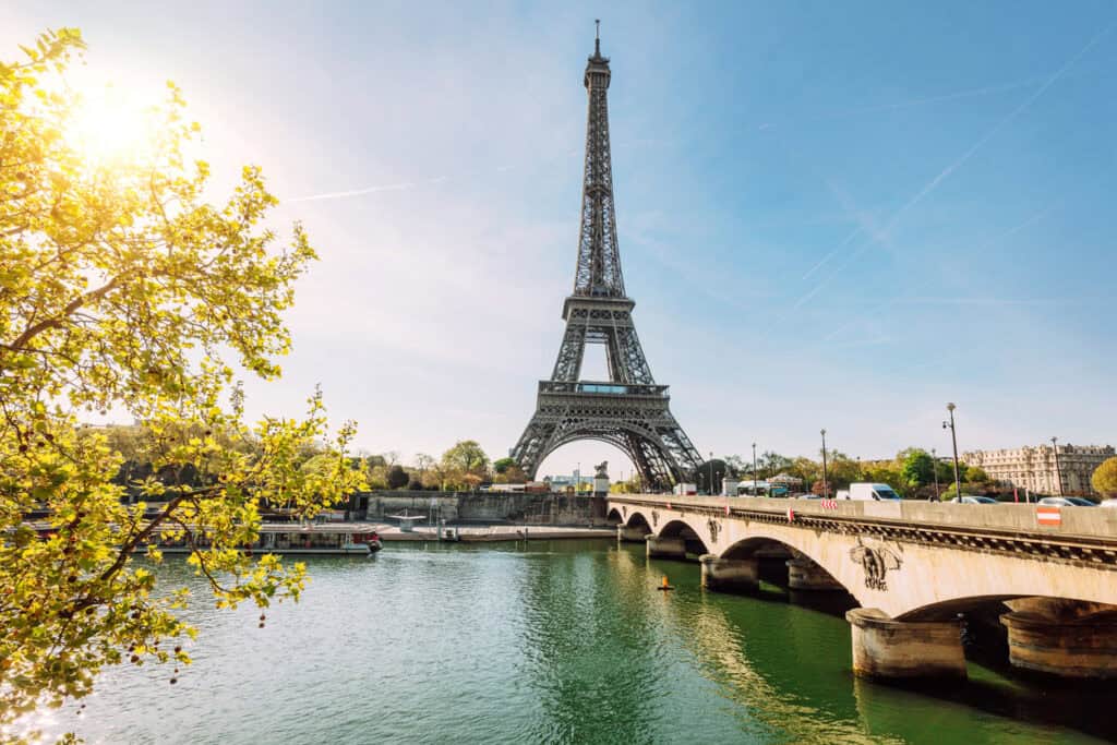 Eiffel Tower and River Seine in Paris, France, with a clear sky and sunny weather.