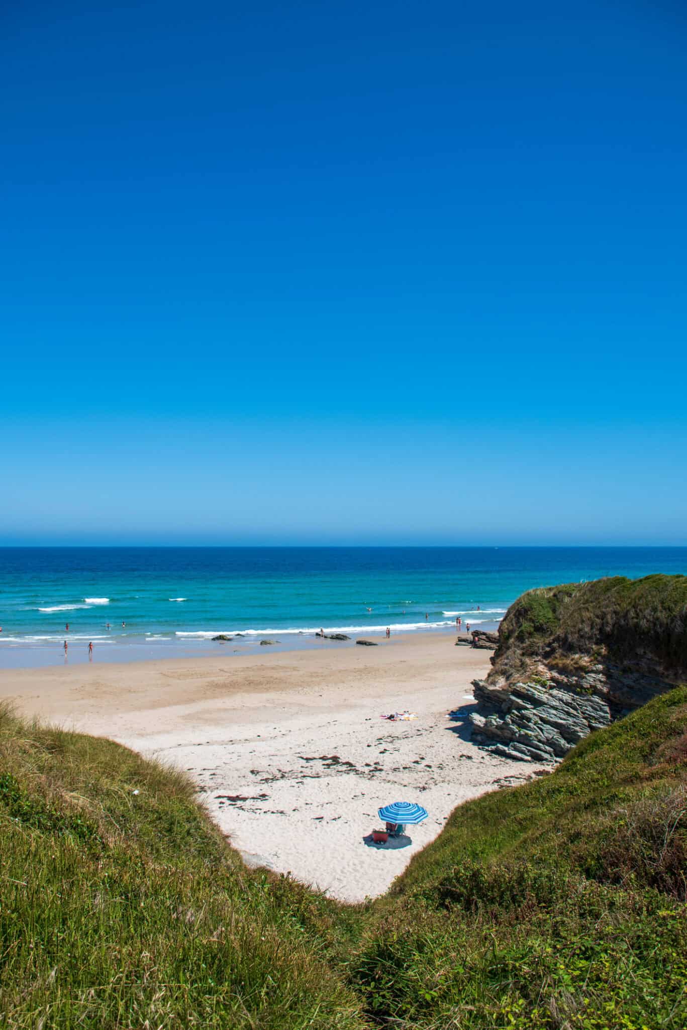 Scenic beach view from St Christopher's Berlin - Mitte hostel, showing sandy shores and blue sea.