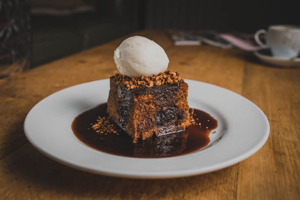 Chocolate cake with ice cream, served on a white plate at St Christopher’s Berlin - Mitte.